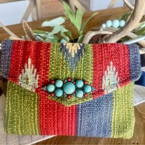 Catori southwest textile rug clutch /wristlet with a  faux turquoise broach.